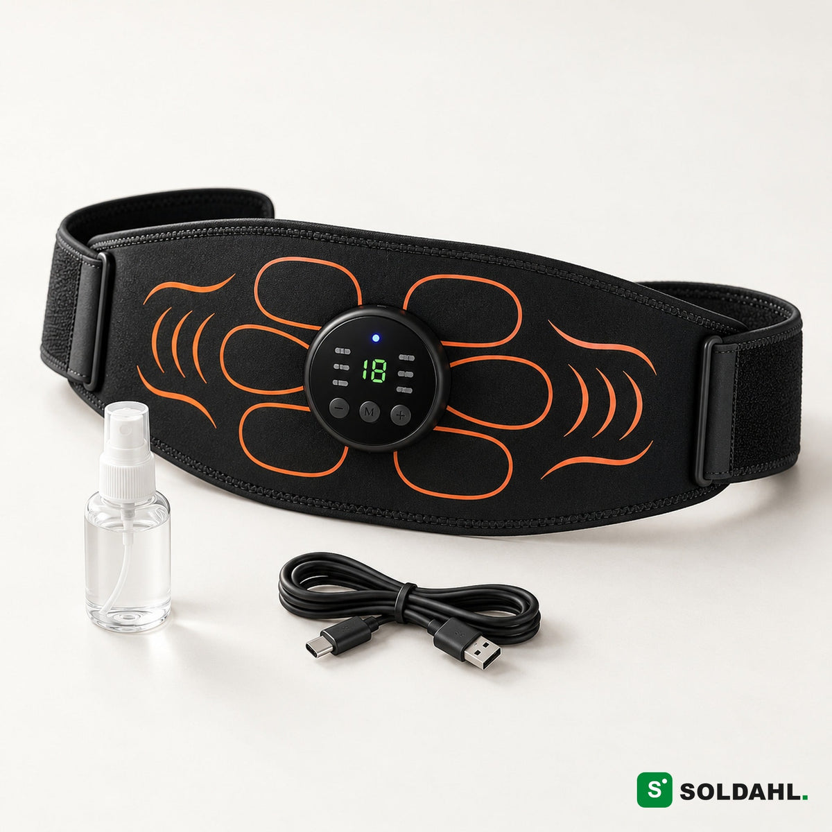 Musta EMS-vatsavyö oranssilla kuviolla, pyöreä ohjain, suihkepullo ja USB-C-johto