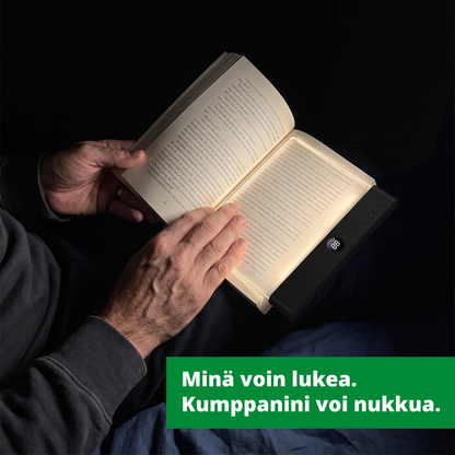 Minä voin lukea. Kumppanini voi nukkua. Läsro on kirjan sivun päällä pimeässä